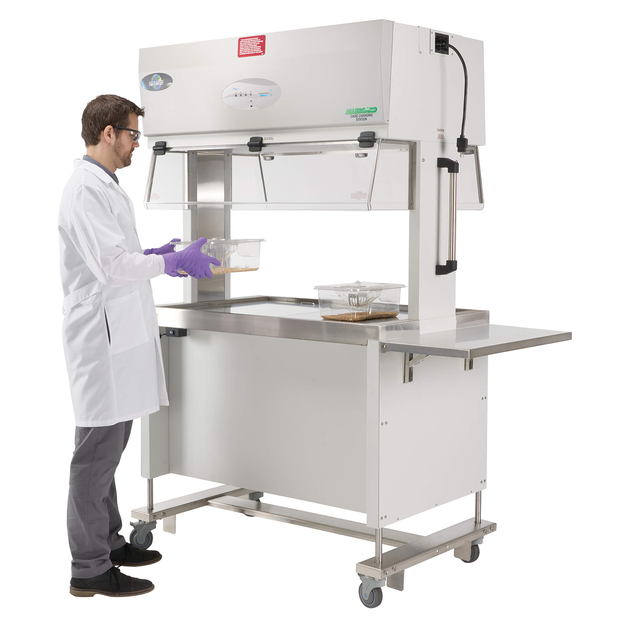 Laboratory technician handling mouse cage inside NuAire AllerGard NU-622 dual-sided animal transfer station