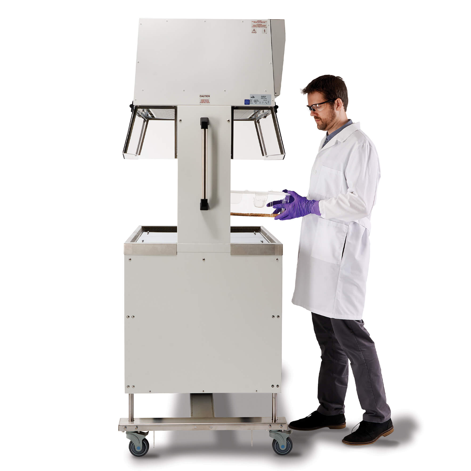 Laboratory technician using NuAire NU-622 Dual-Sided Animal Transfer Station from side access