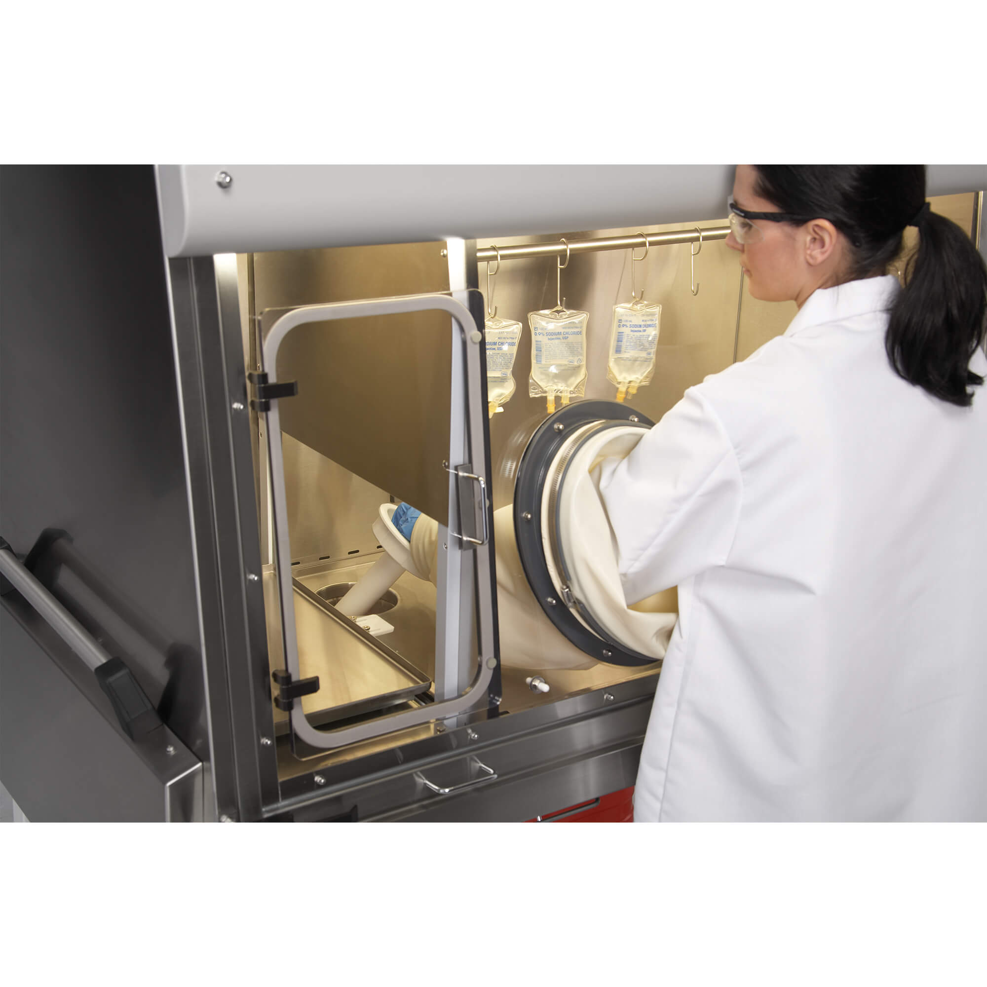 Pharmacy Technician Disposing Waste in a Compounding Aseptic Isolator